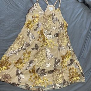 Bought this as a backup wedding guest dress and never wore it. Brand new!